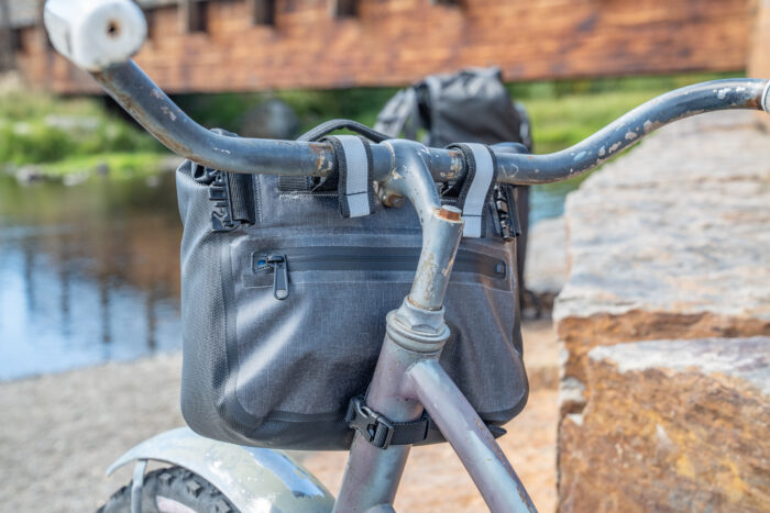 soft cooler attached to cruiser bike handlebars