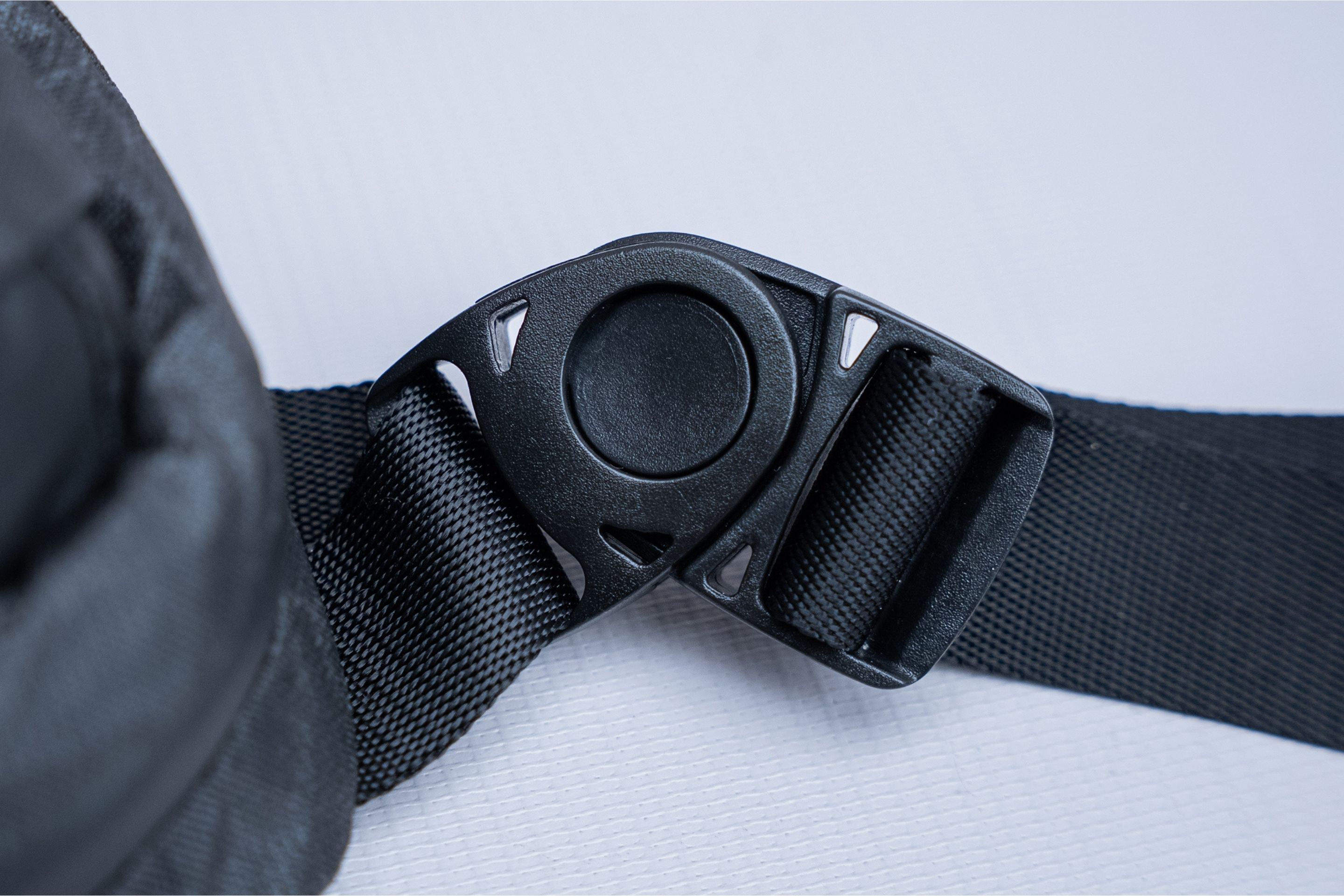 close up shot of black buckle on bag 