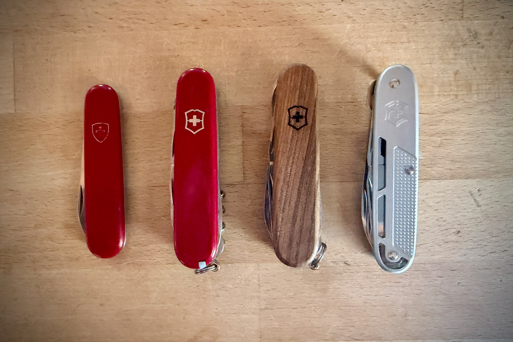 Victorinox Synergy X Alox shown alongside several other Swiss Army Knife models