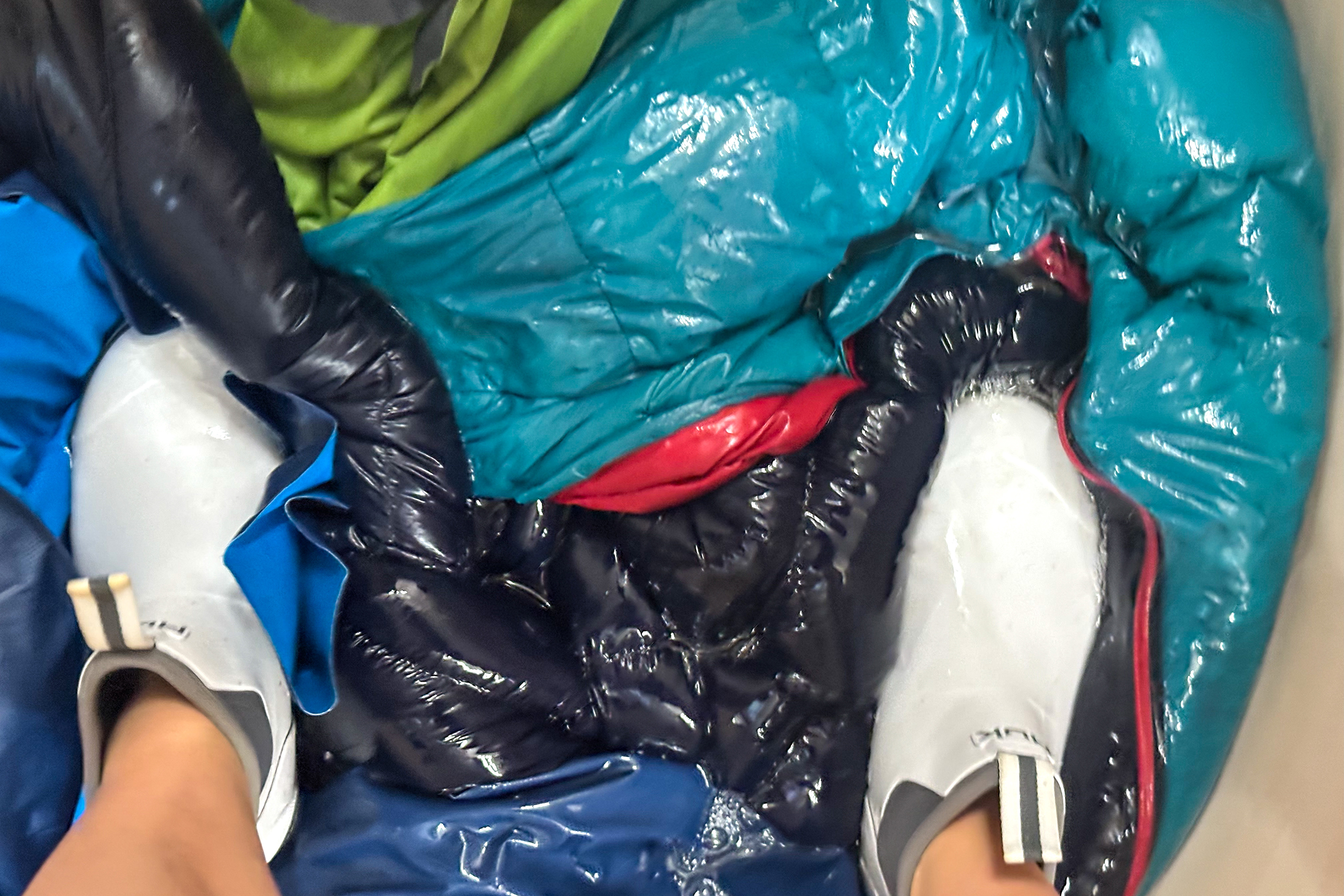 Squishing water out of a sleeping bag.