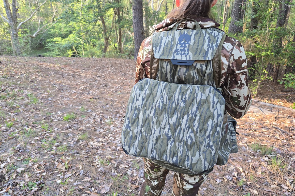 The Flydown system is worn on the back while walking through the woods
