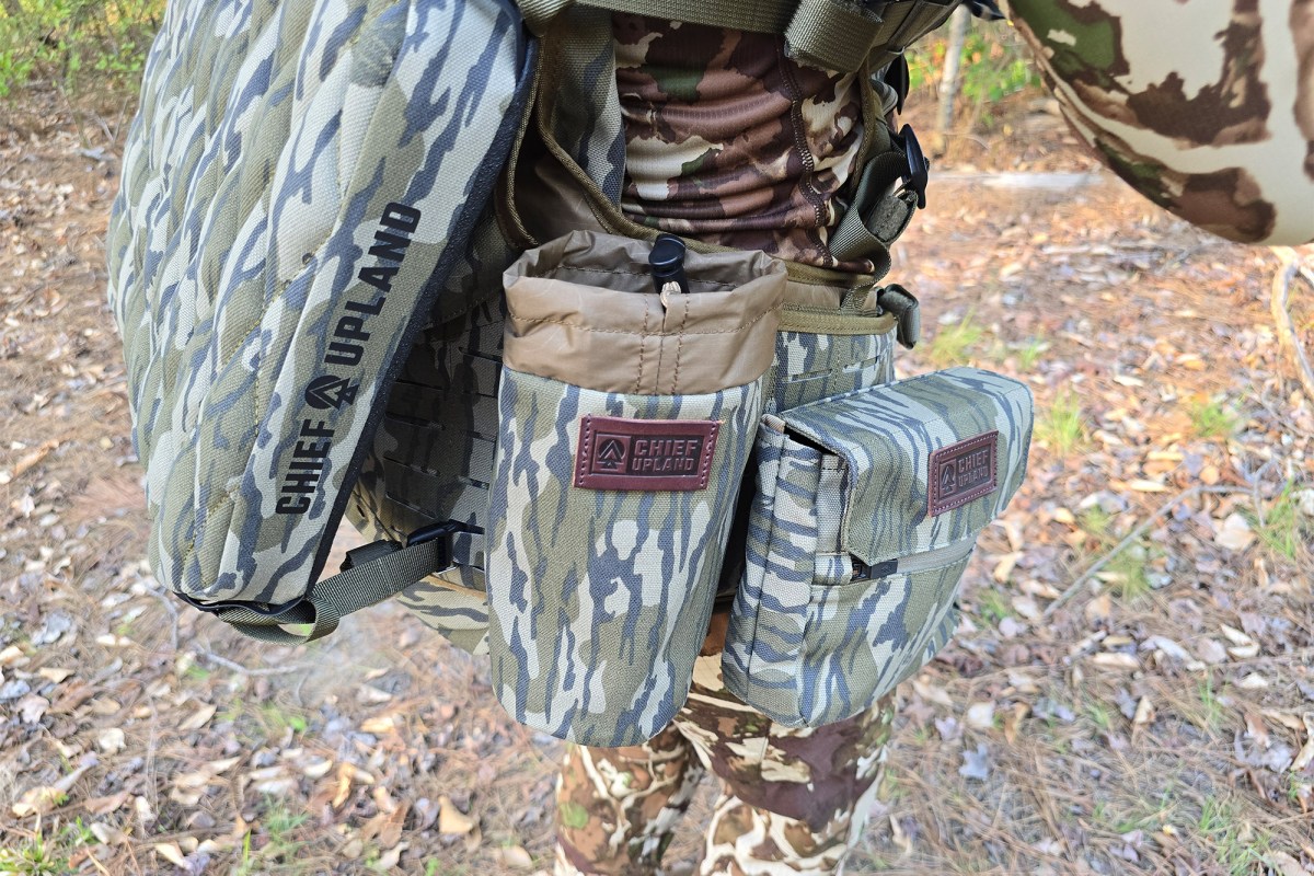 The Flydown system shows multiple side pockets and a holder attached to the pack