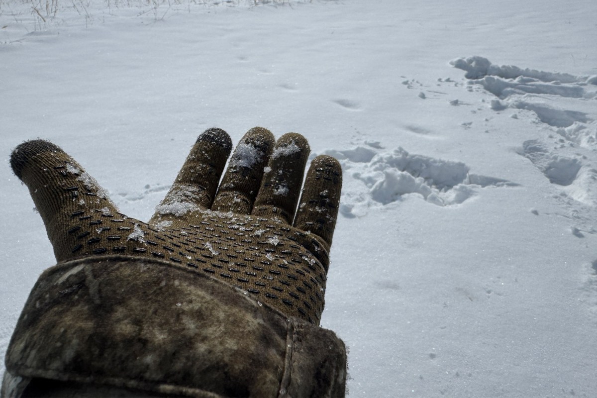 Cross Point Gear Pro Wool Gloves covered with snow showing grip texture