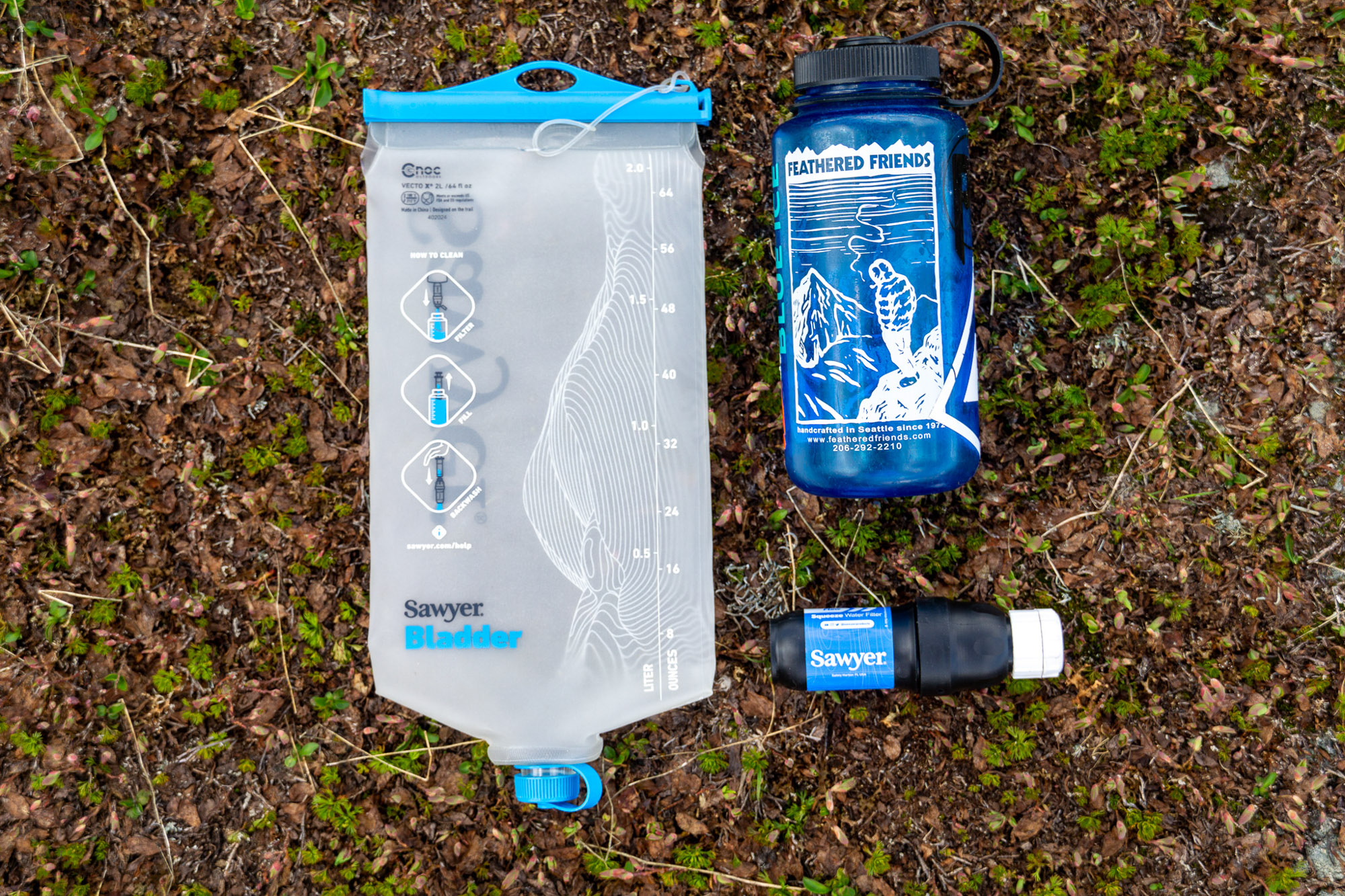 the sawyer squeeze filter and cnoc bladder together with a nalgene bottle for scale