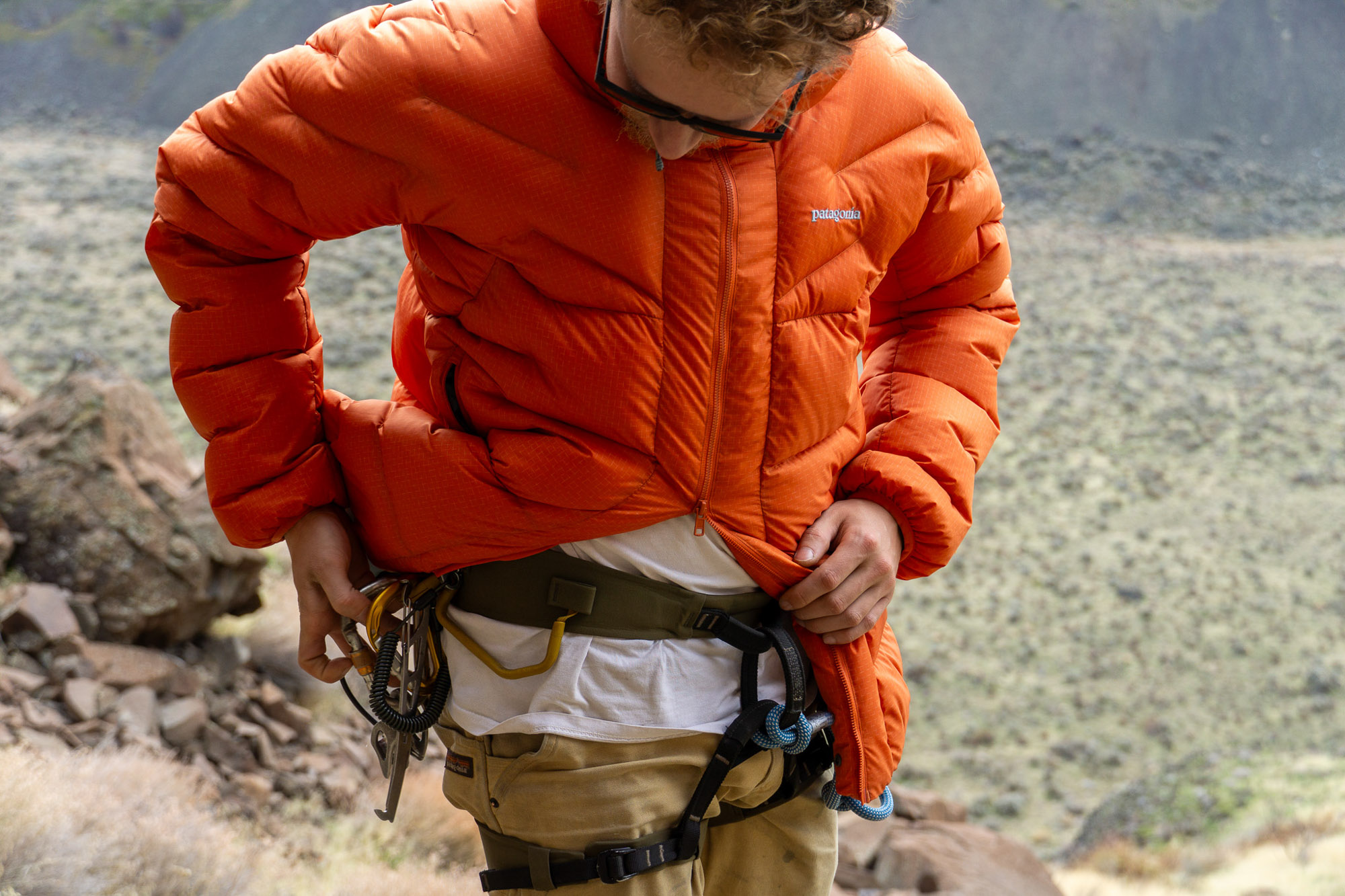 a gearjunkie tester wearing the patagonia durable down parka while climbing in washington state