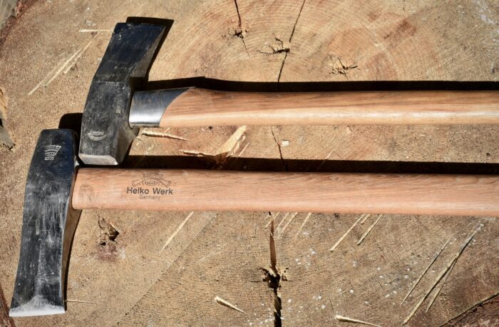 showing the wooden axe handles of the helko werk nordic splitter and the gransfors bruk splitting maul