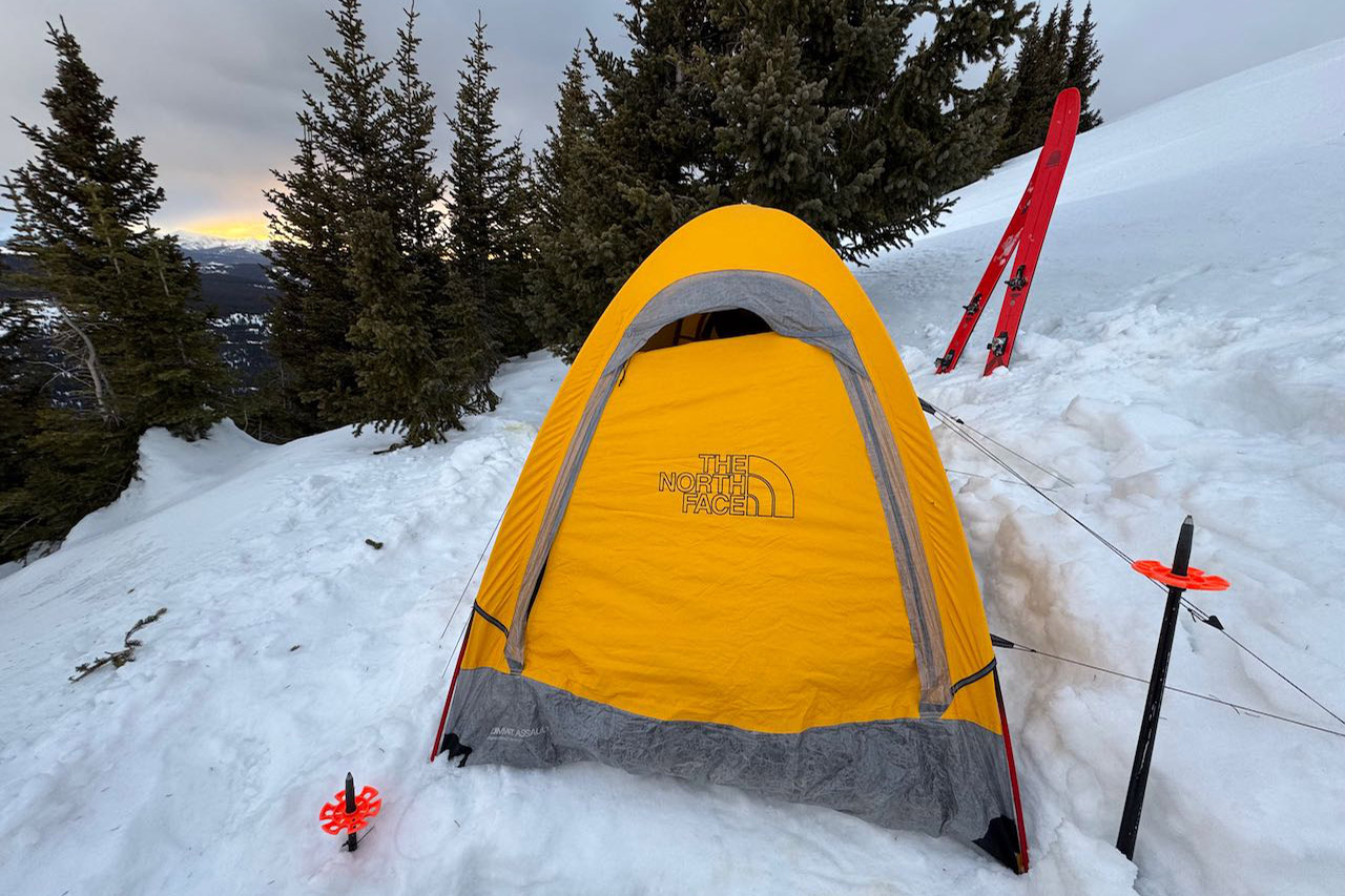 Front view of Assault 2 AMK tent secured in snowy terrain