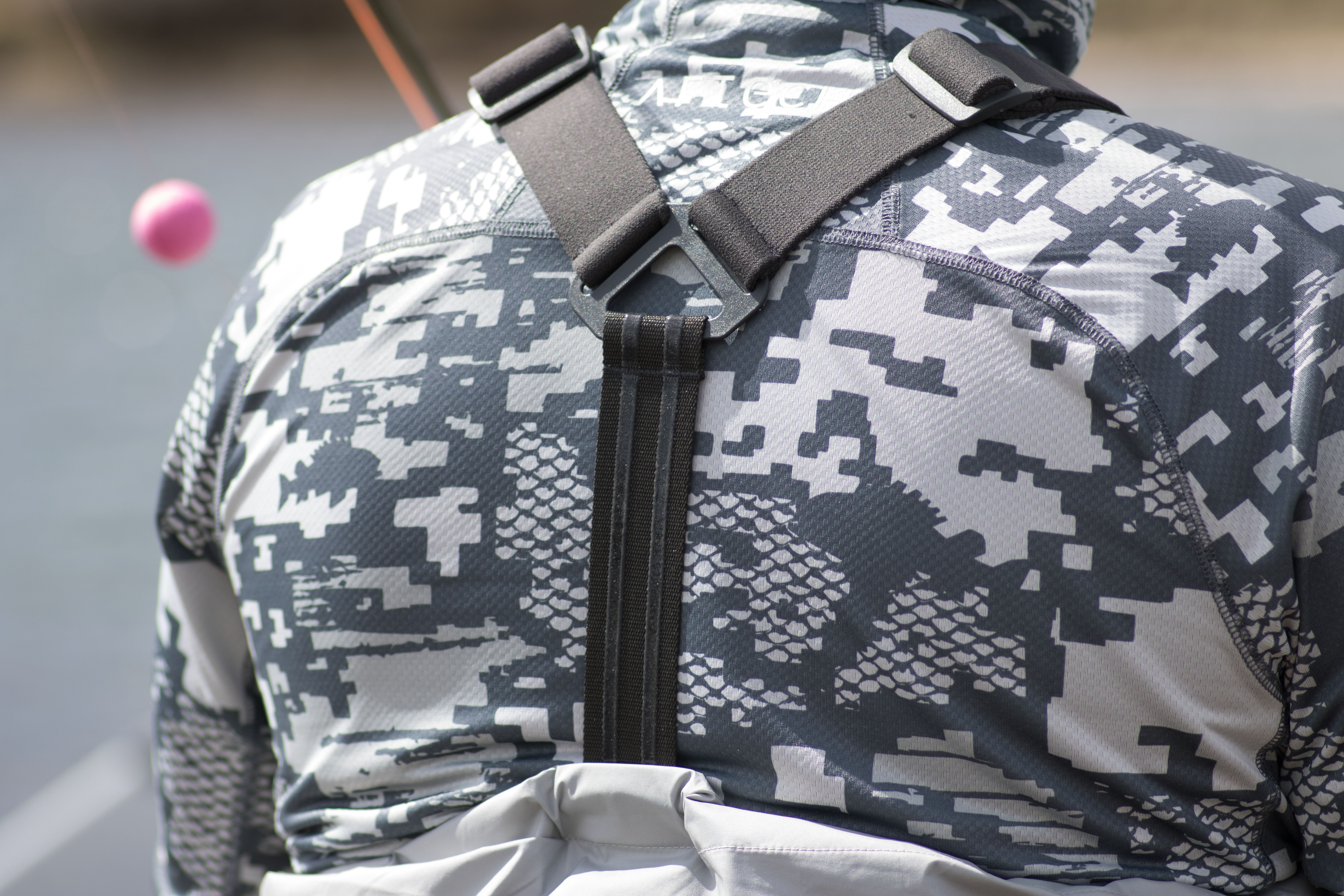 The straps on the Simms Flyweight Waders lock in from the rubber stopper strips.