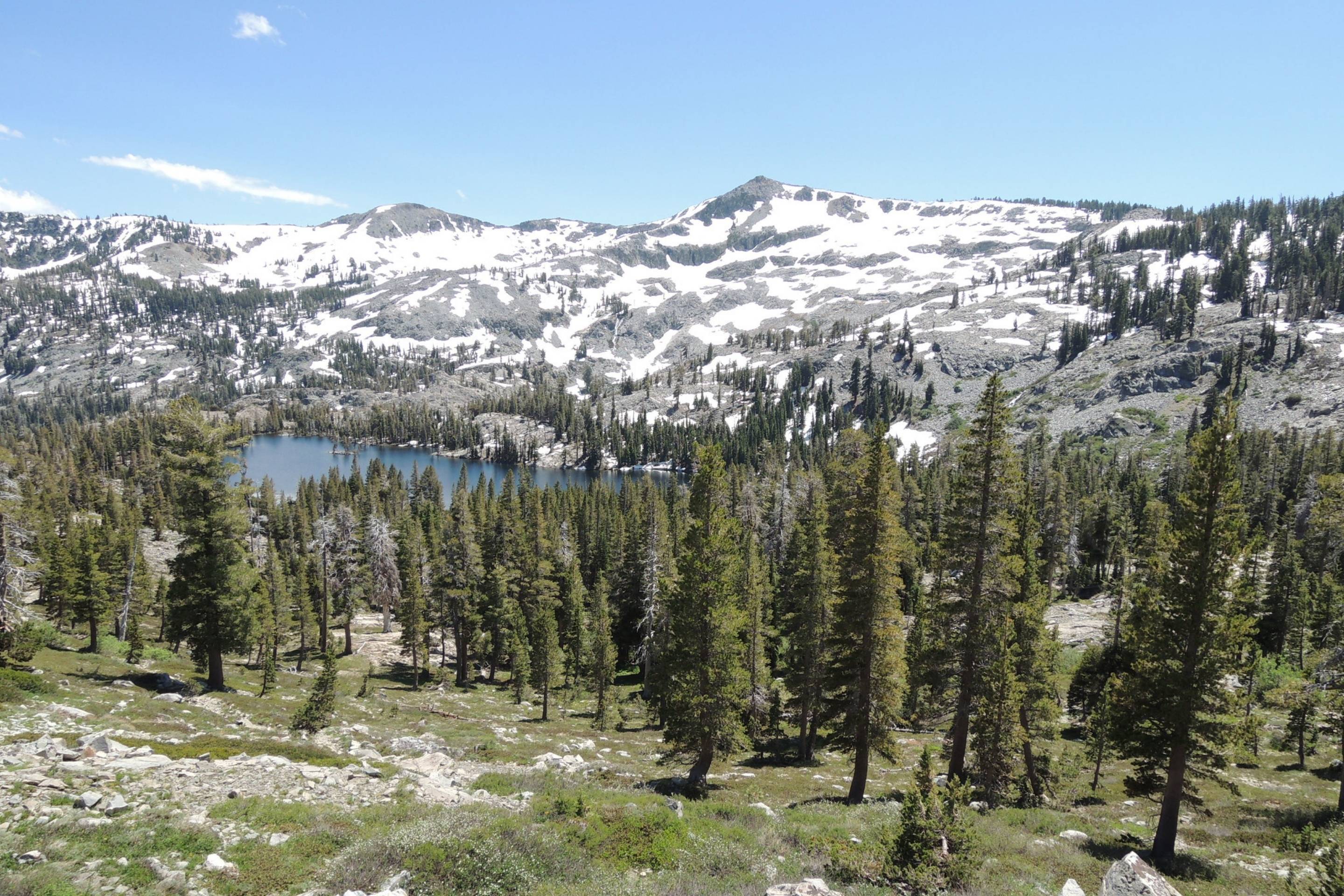 mountain with snow and alpine lake