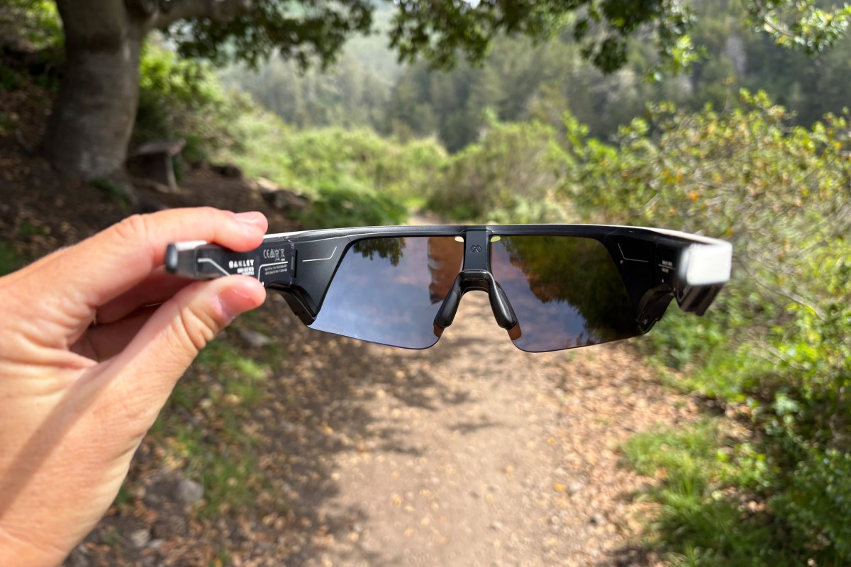 Back view of Oakley Meta AI Vanguard glasses in hand