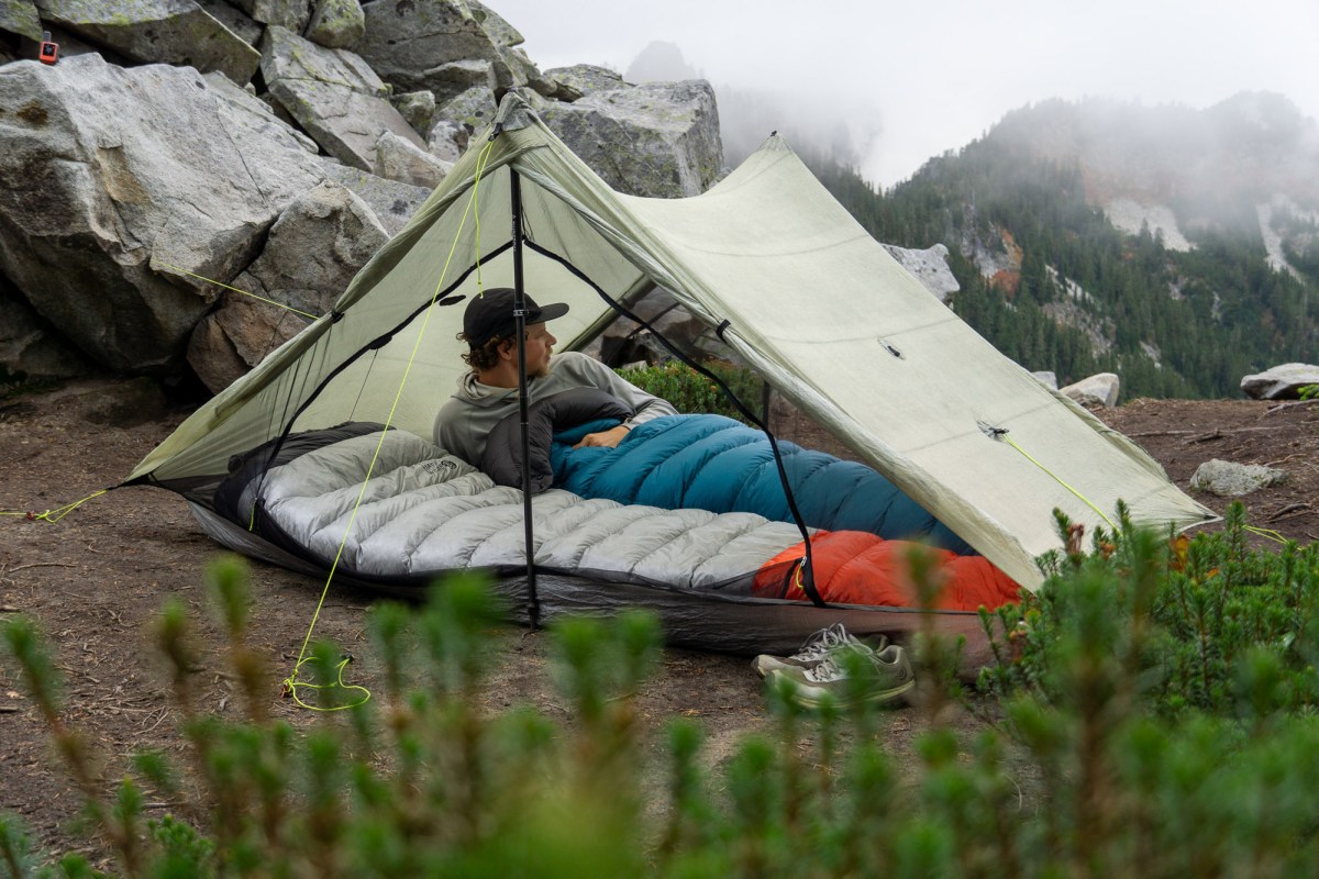 a gearjunkie tester in the zpacks duplex tent in a camp site on the pacific crest trail in washington state