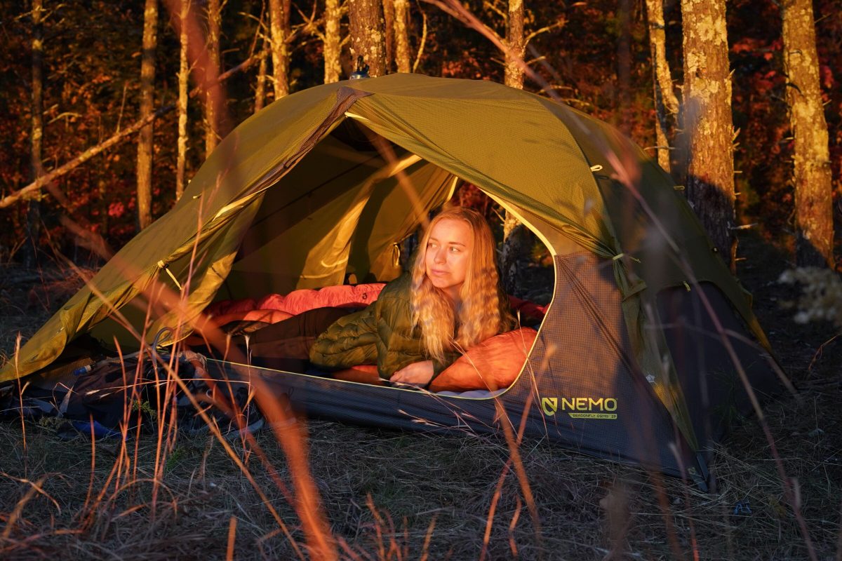 a gearjunkie tester in. a backpacking sleeping bag in a nemo tent