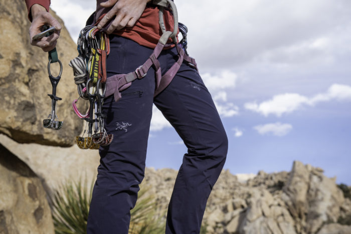 A Climber Adjusts Her Climbing Protection in Joshua Tree National Park While Wearing the Arc'teryx Women's Gamma LT Pants Detail