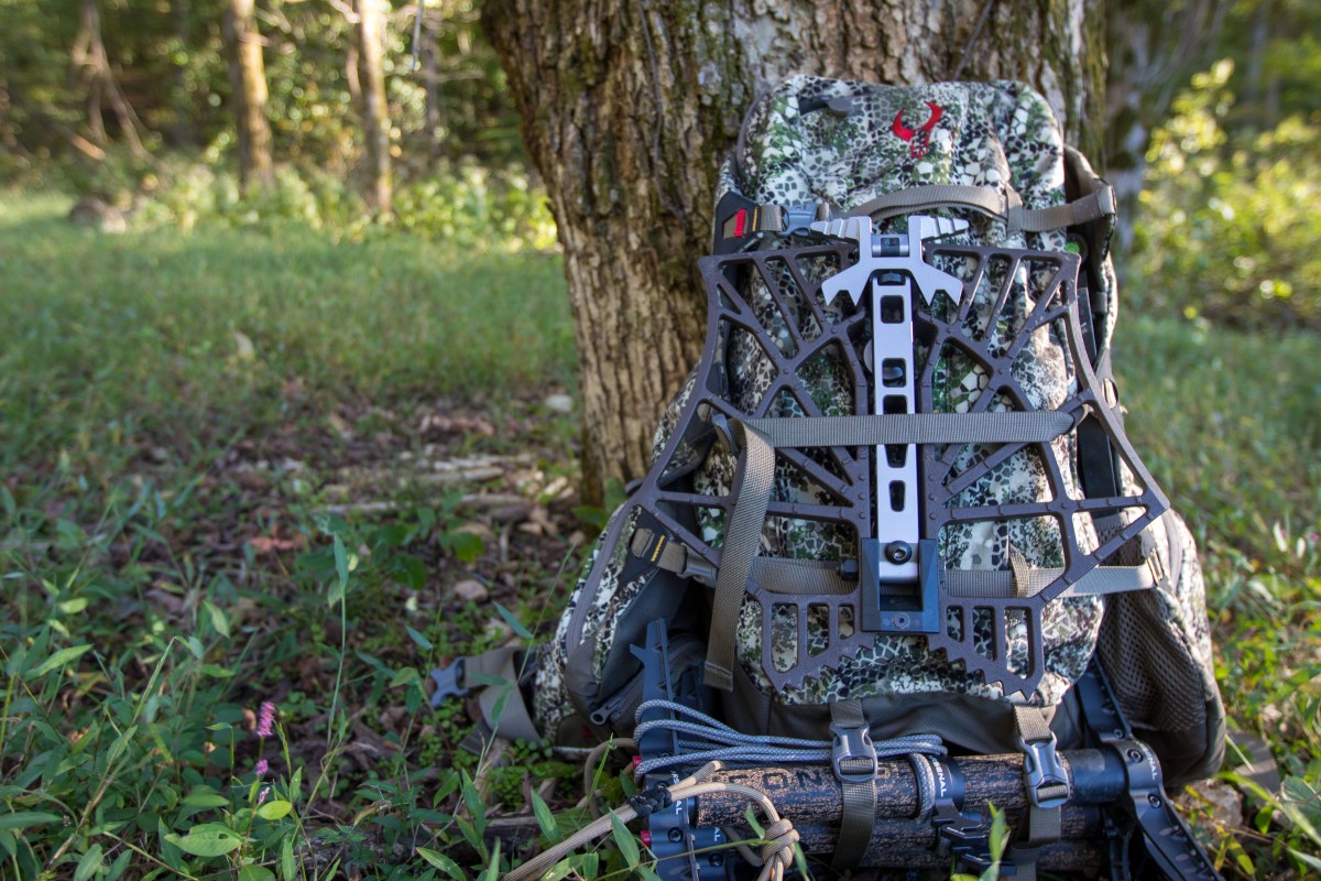 The Badlands 2200 with a platform and climbing sticks attached to it leaning agains a tree.
