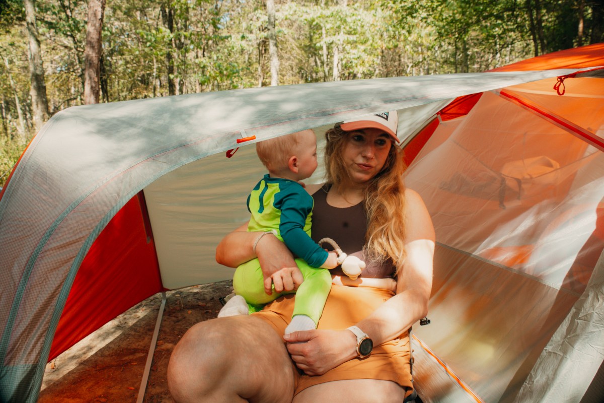 UL3 tent vestibule showing covered space with person sitting and child inside