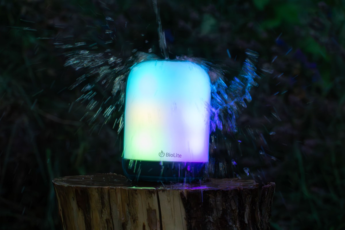 the BioLite AlpenGlow 500 Lantern being splashed with water during gearjunkie in-house water-resistance testing