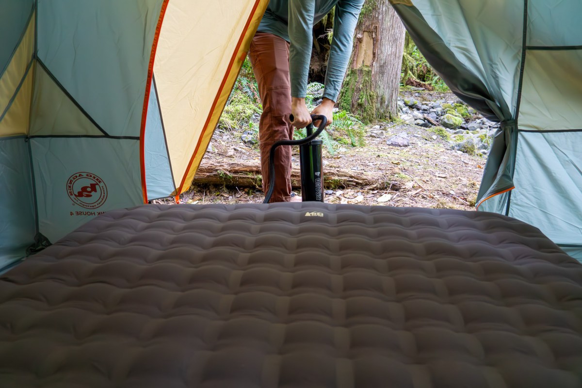 gearjunkie senior editor nick belcaster pumping up a camping air mattress in washington state