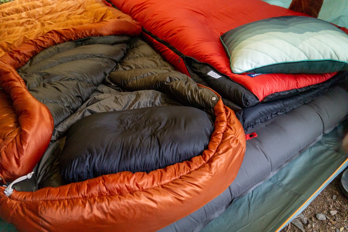 two down-filled sleeping bags (sea to summit Basecamp and feathered friends penguin) inside a tent while testing