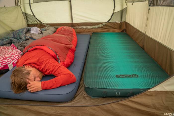 editorial director sean mccoy testing camping mattresses in colorado during a gearjunkie camp week