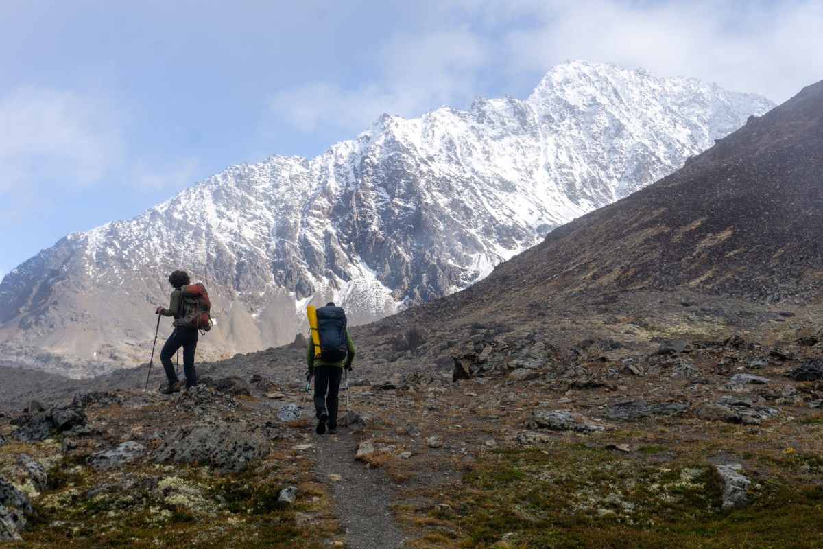 trekkers in Alaska's Chugach range ascend a trail