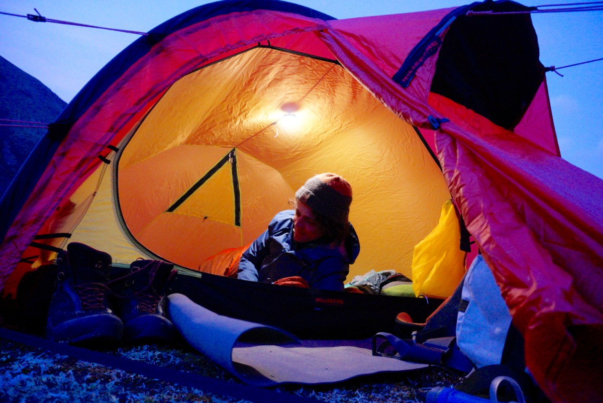 gearjunkie tester using a compact Black Diamond Moji Lantern in Tent while testing in alaska