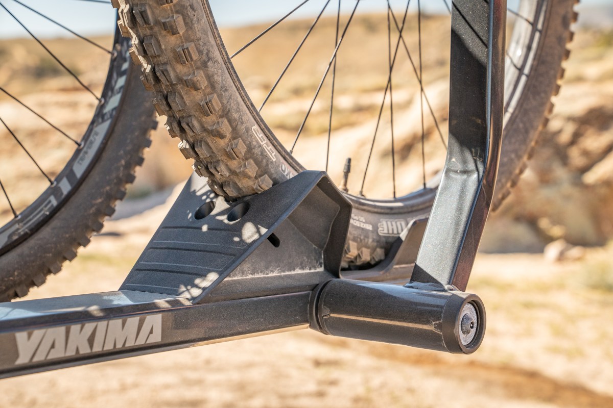 In some designs, the front bike tires rest in an angled tray while the back tire is secured with an adjustable ratchet strap; (photo/Eric Phillips)