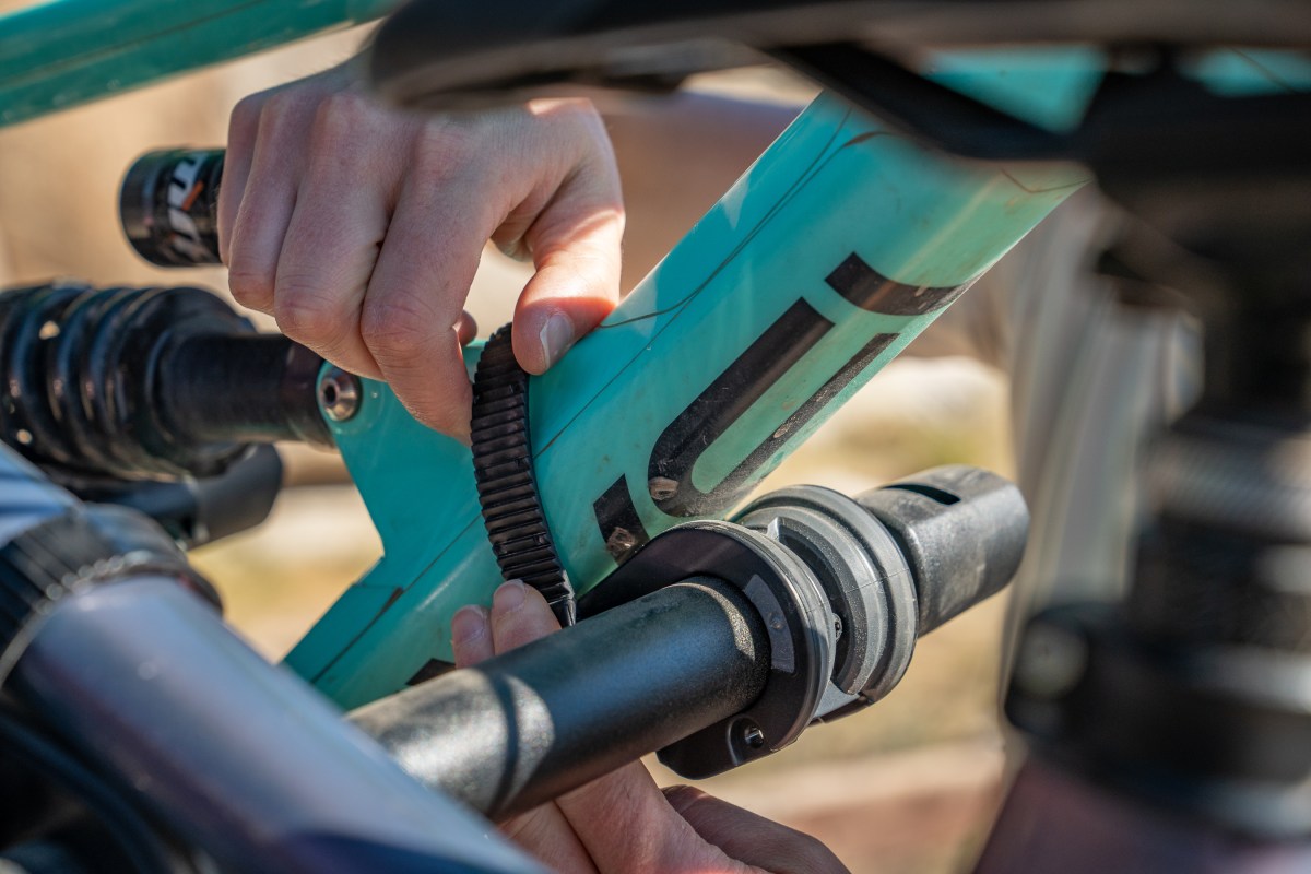 Ratchet straps on hanging racks are pliable and adaptable to different frame sizes; (photos/Eric Phillips)
