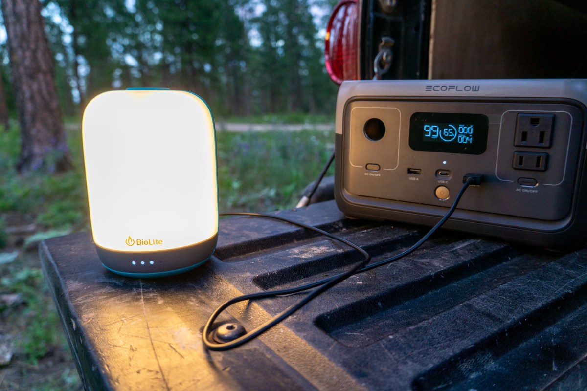 the BioLite AlpenGlow Lantern Charging from a portable power station on a truck tailgate in montana
