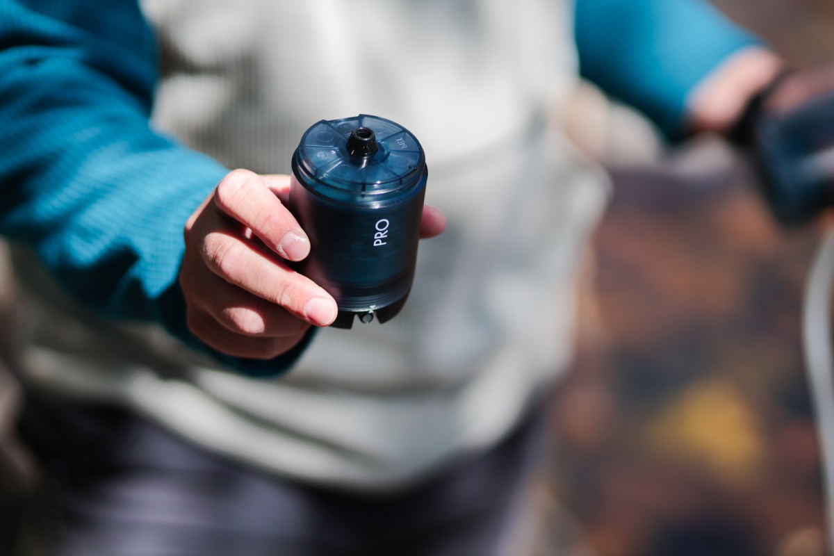 Person holding the Katadyn purifier filter cartridge during setup