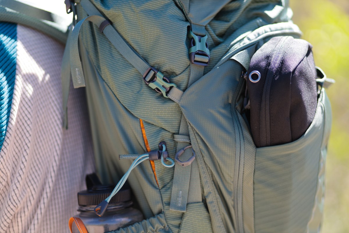 The Gregory Baltoro 65 backpack holds a water bottle and small gear in its side pockets