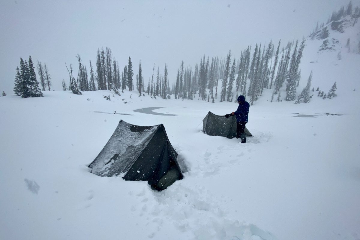 gearjunkie tester chris carter testing backpacking tents in a heavy snowstorm