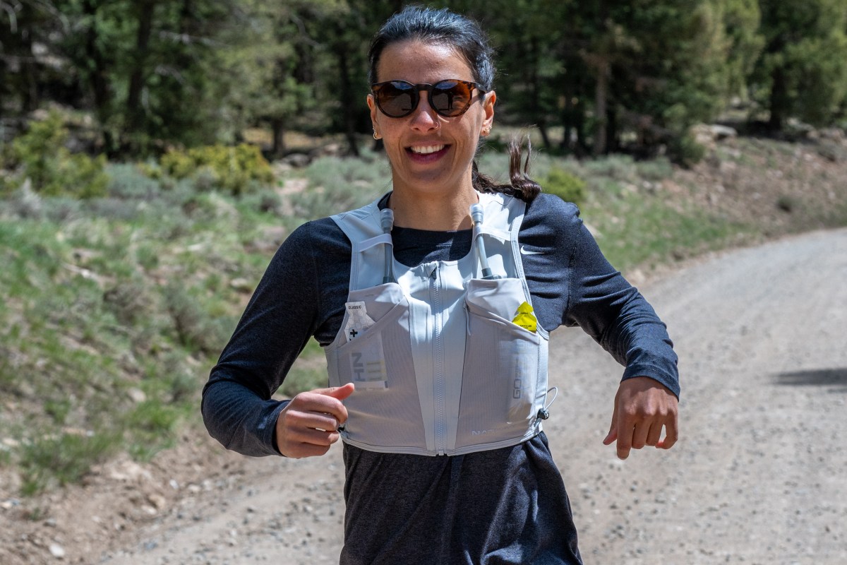 How to Choose a Running Vest A woman wearing the Nathan AeroZip 1L run vest