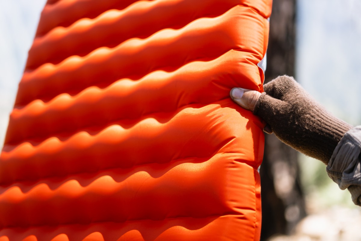 Close-up of the orange side of the Tensor sleeping pad showing the raised baffle pattern