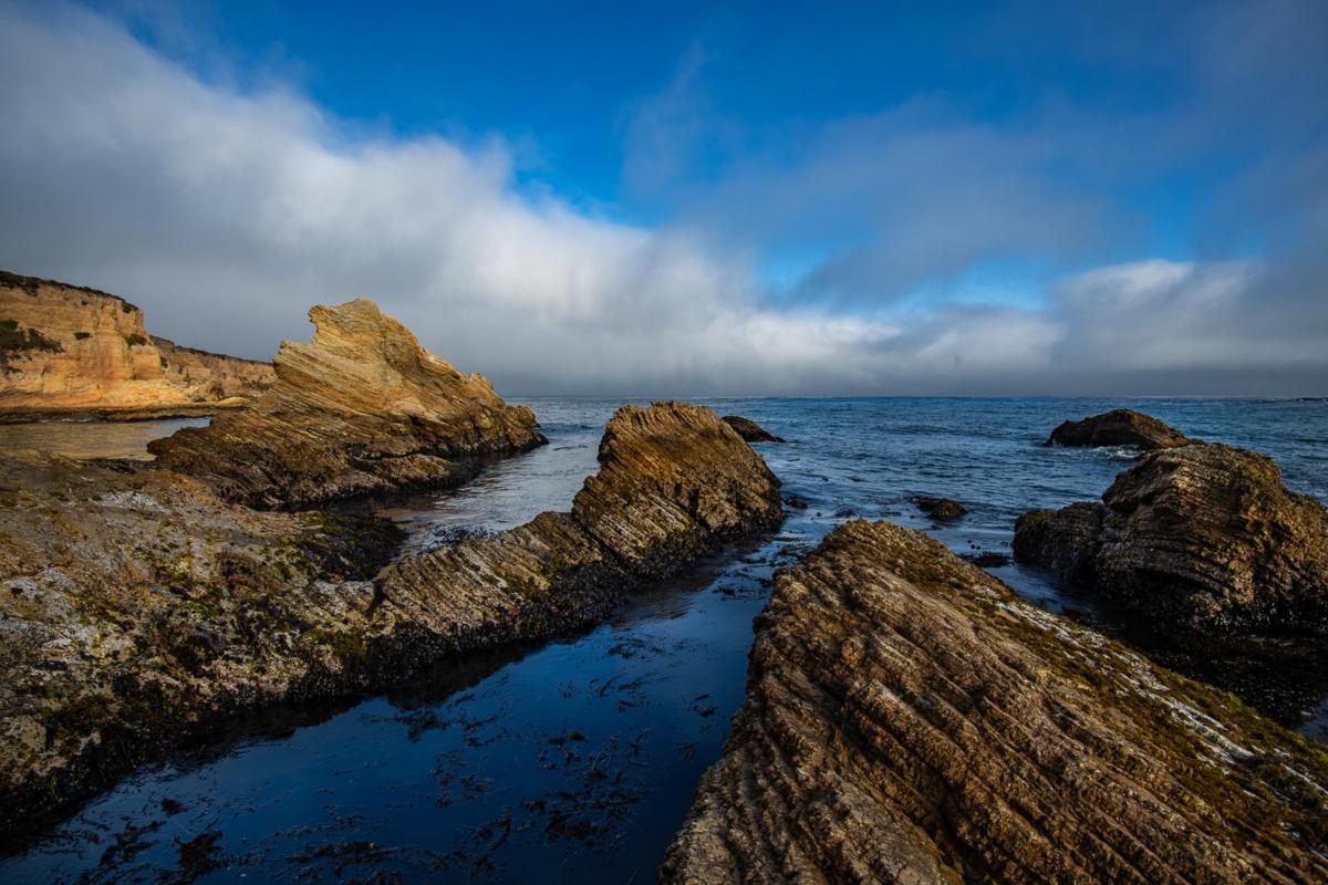 ocean with rocks sticking up and out