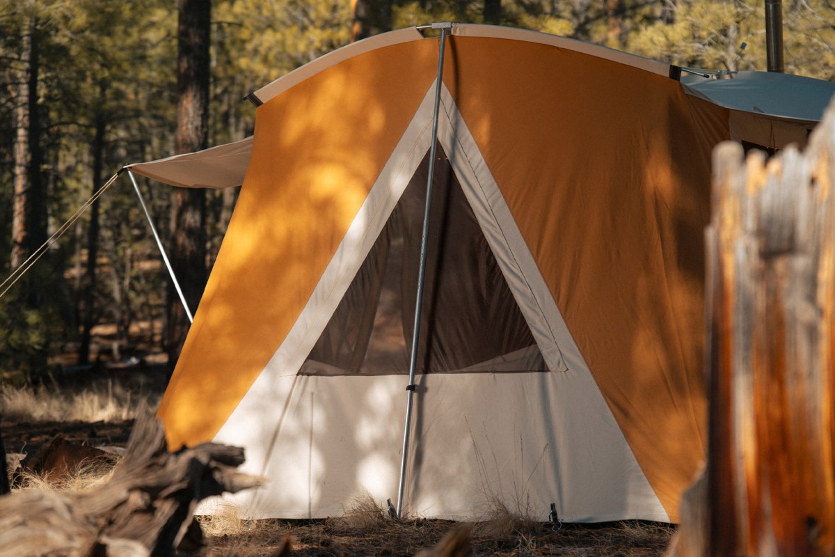 Springbar Skyliner tent side window with mesh panel and support pole at a wooded campsite
