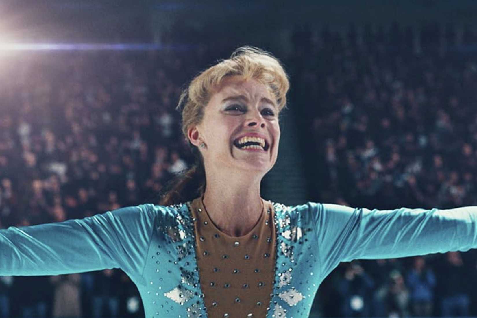 Tonya Harding smiles on the ice during a figure skating competition in I, Tonya.