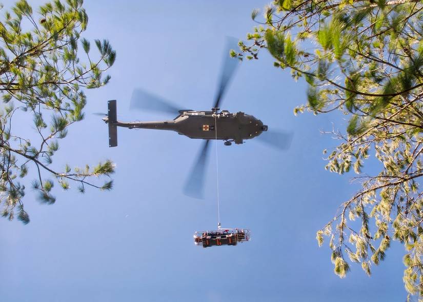 Military helicopter demonstrates U.S. Army VRS system using Skedco emergency rescue technology (U.S. Army).