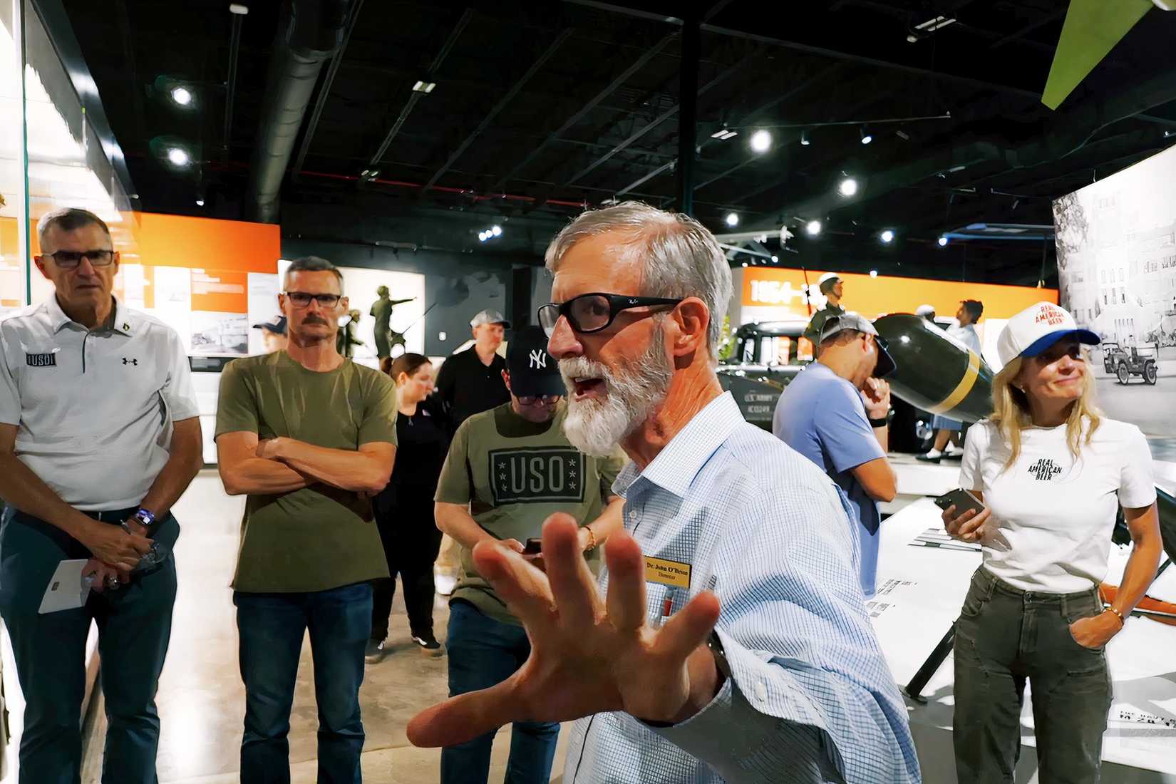 Dr. John O’Brien speaks beside a D-Day exhibit inside the Tennessee Wings of Liberty Museum at Fort Campbell.