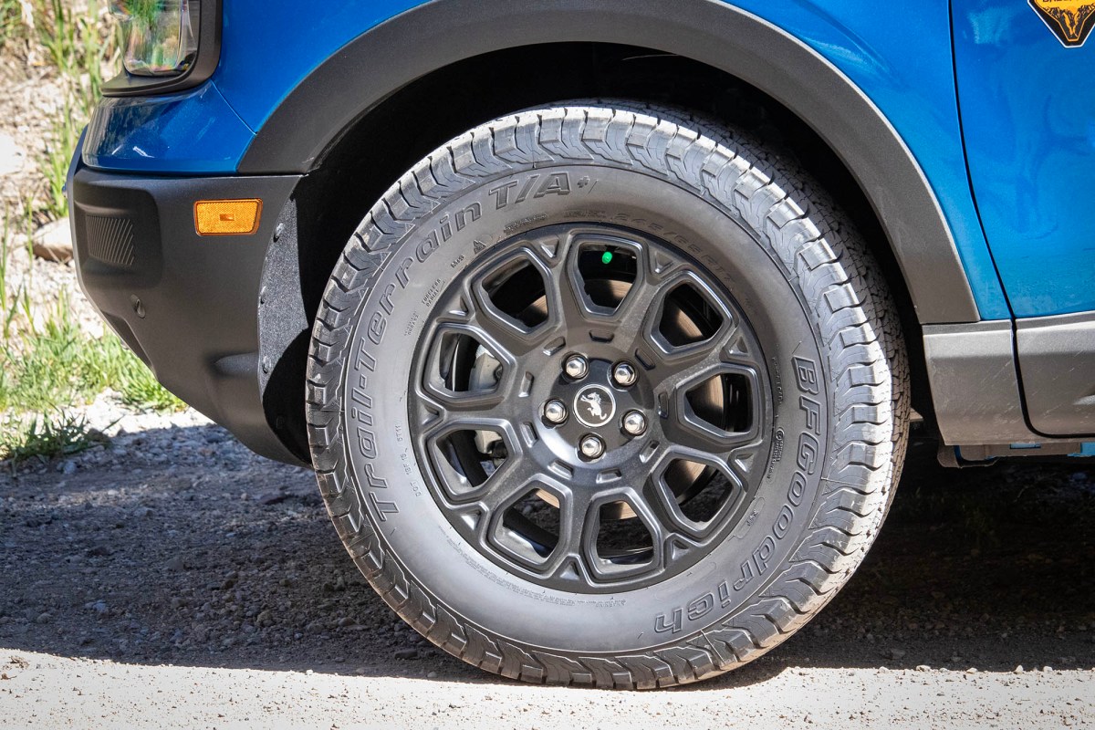 Close-up of a BFGoodrich Trail-Terrain T/A+ tire on a blue Ford Bronco Sport