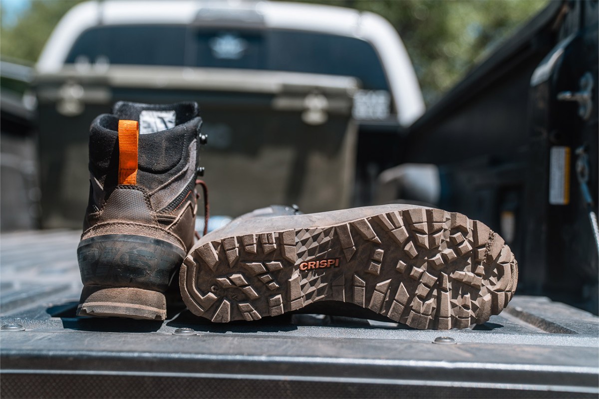 Crispi boot outsole showing the deep tread pattern on the tailgate of a truck