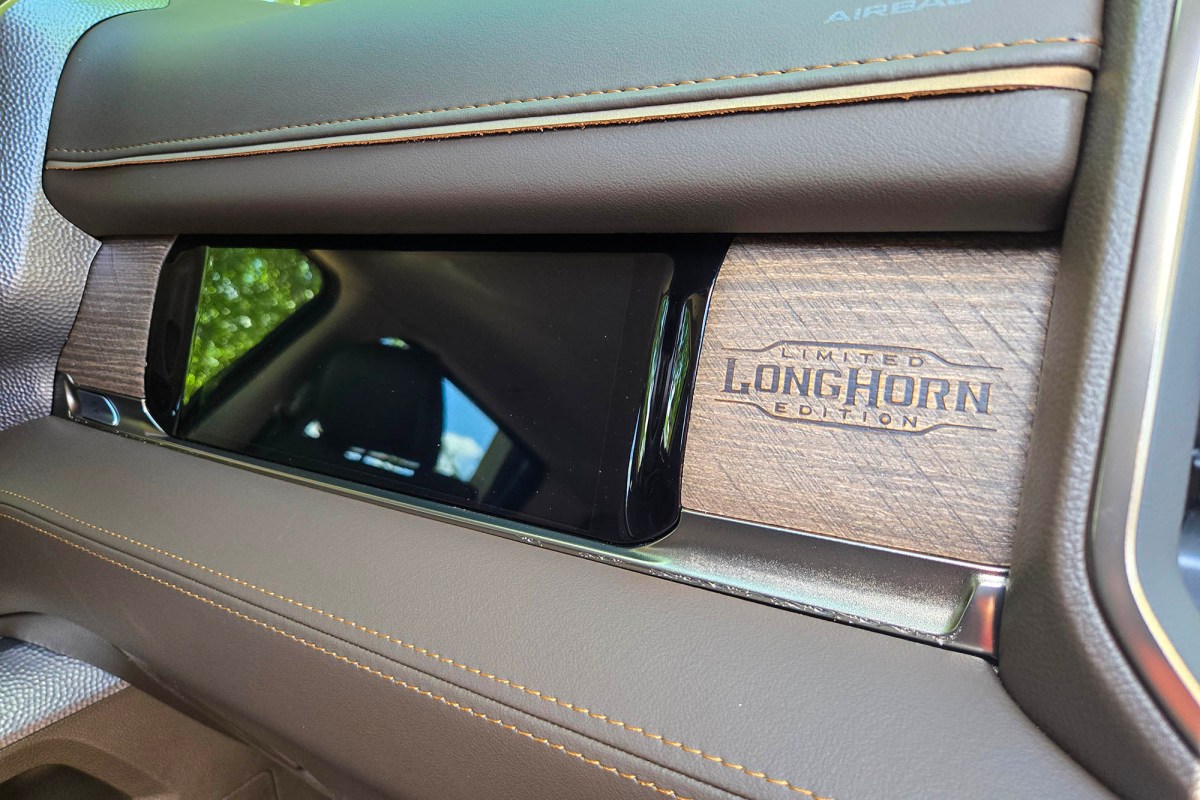 Close-up of Ram Longhorn wood accent on the passenger-side dashboard