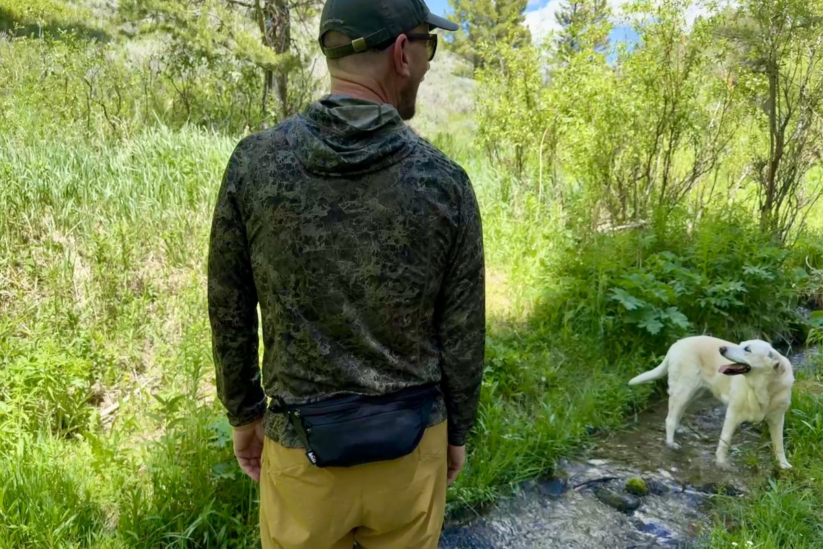 a man wearing the REI Co opTrail 2 Waist Pack