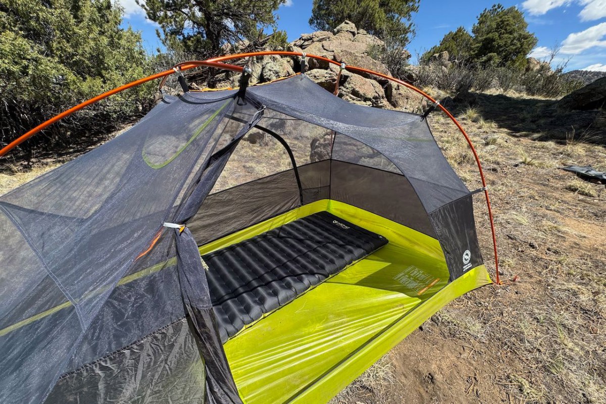 Sleeping pad inside the Tiger Wall UL2 tent with the mesh body and orange poles visible