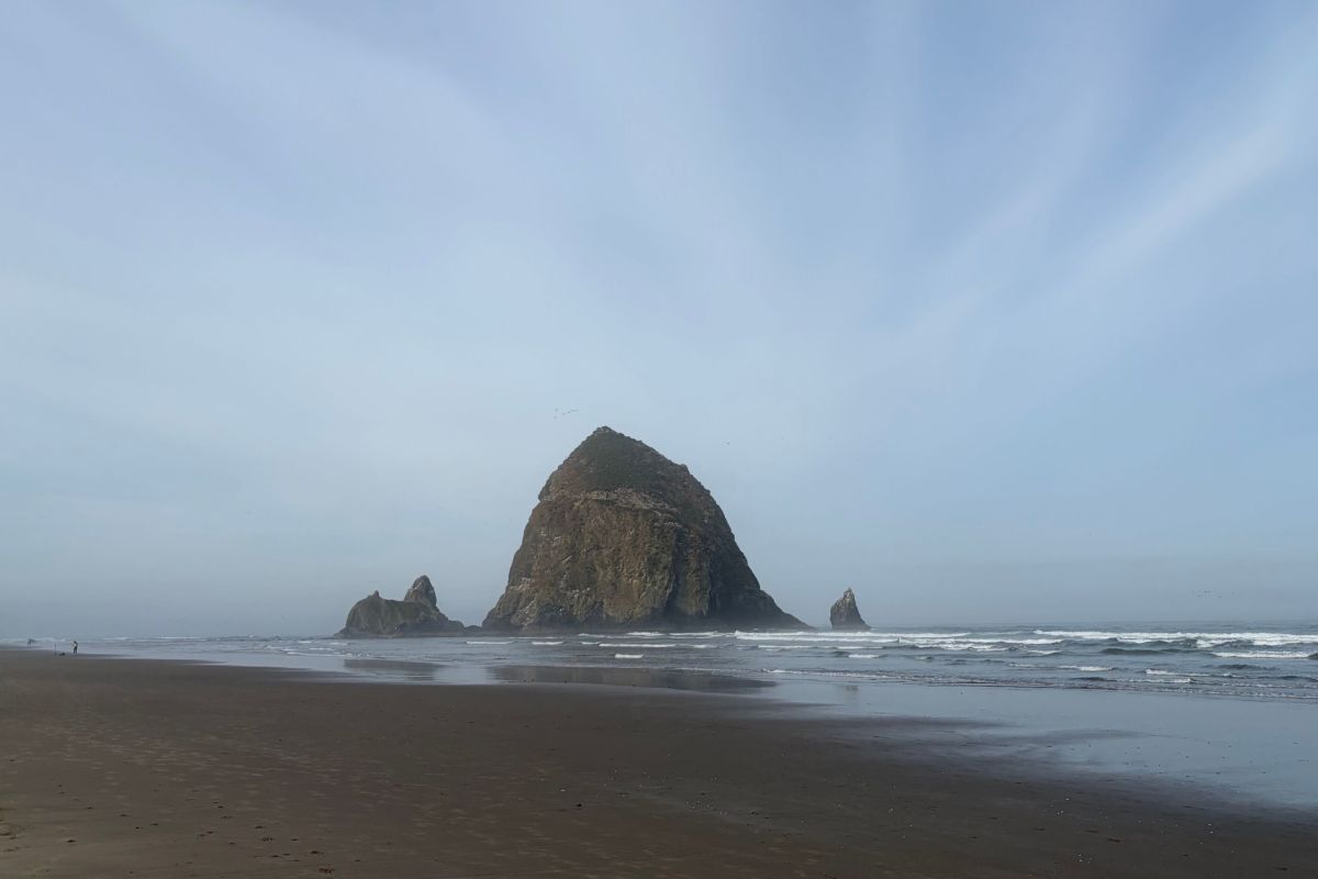 rock rises out of ocean
