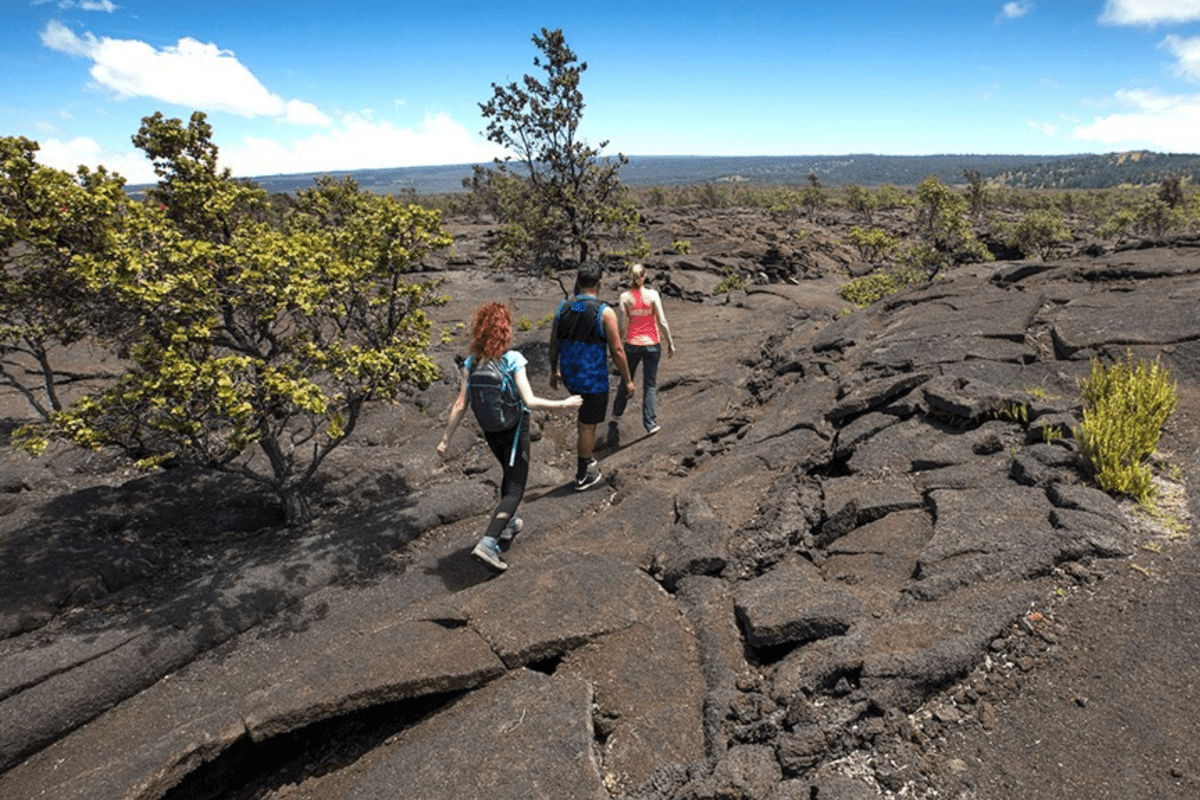 three hikers on old lava flows