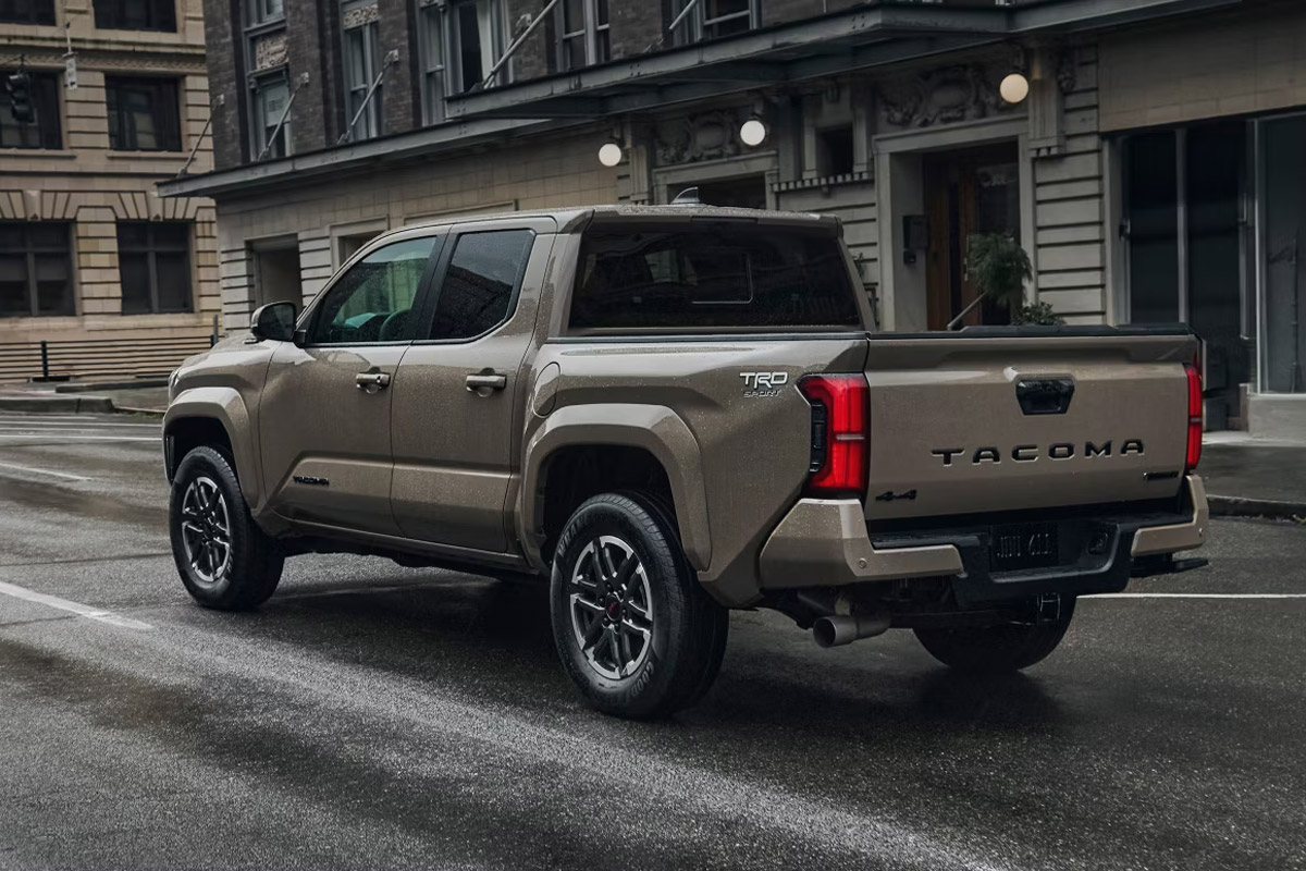 Toyota Tacoma TRD parked on a wet city street