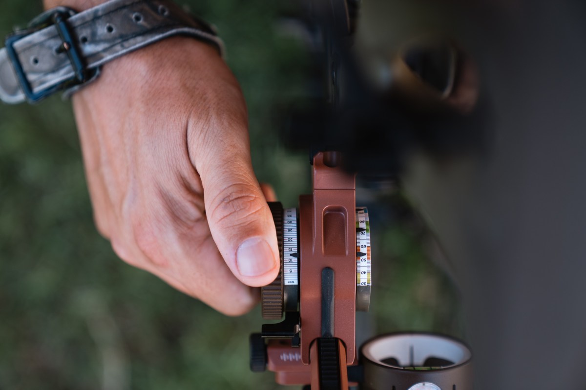 hand on Dialed Archery Pruf 5-Pin Bow Sight 