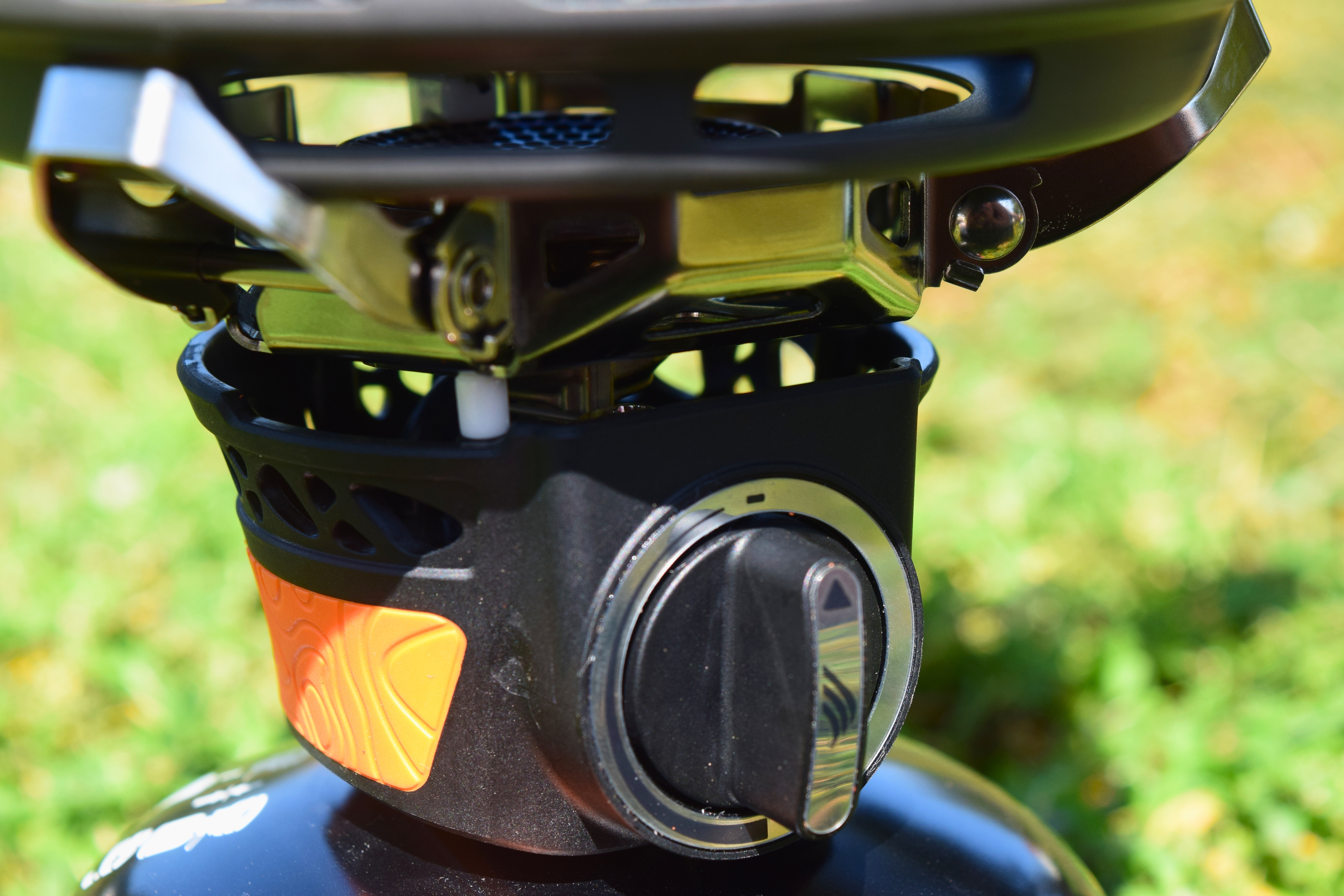 Closeup of the Jetboil burner control knob and metal pot supports