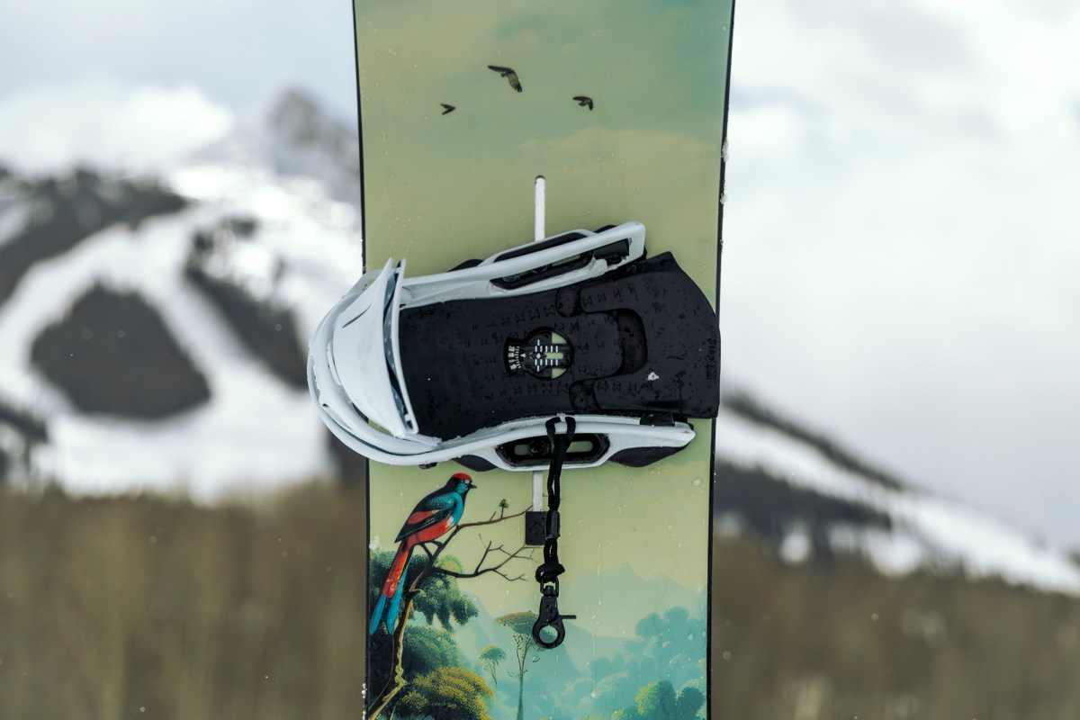 A close up of the Burton Custom Flying V snowboard showing the binding mounted on the board