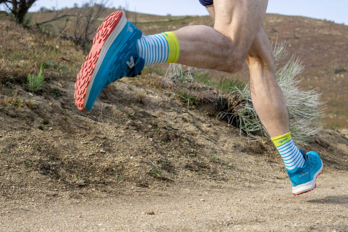 A closeup view of trail running shoes to analyze gait